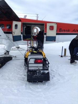 Loading a snowmobile into the Twin Otter